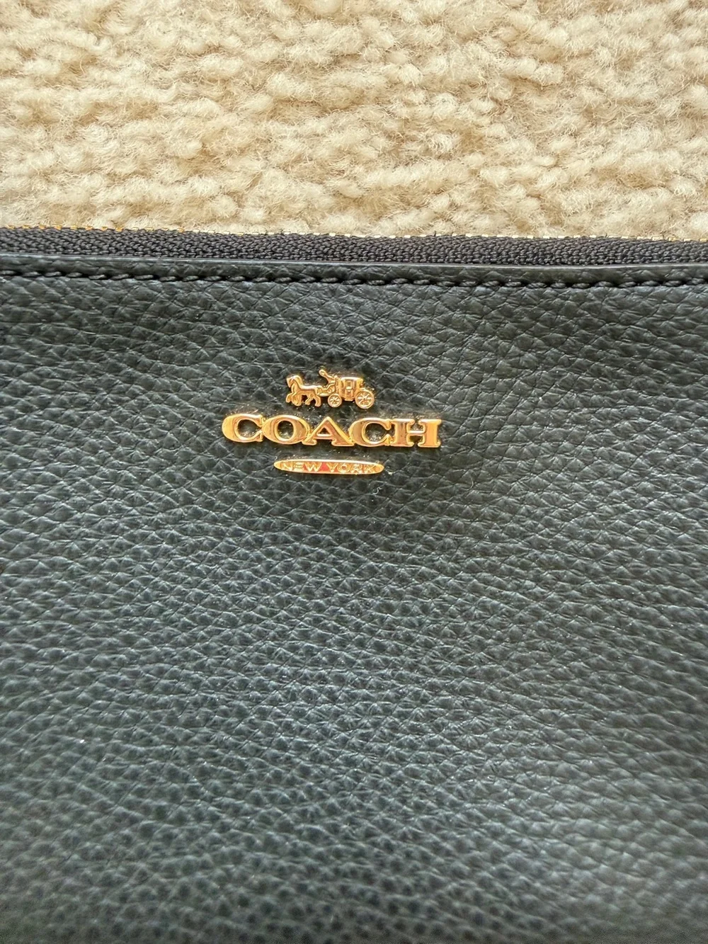 Coach Black Pebbled Leather Pouch with Gold Emblem